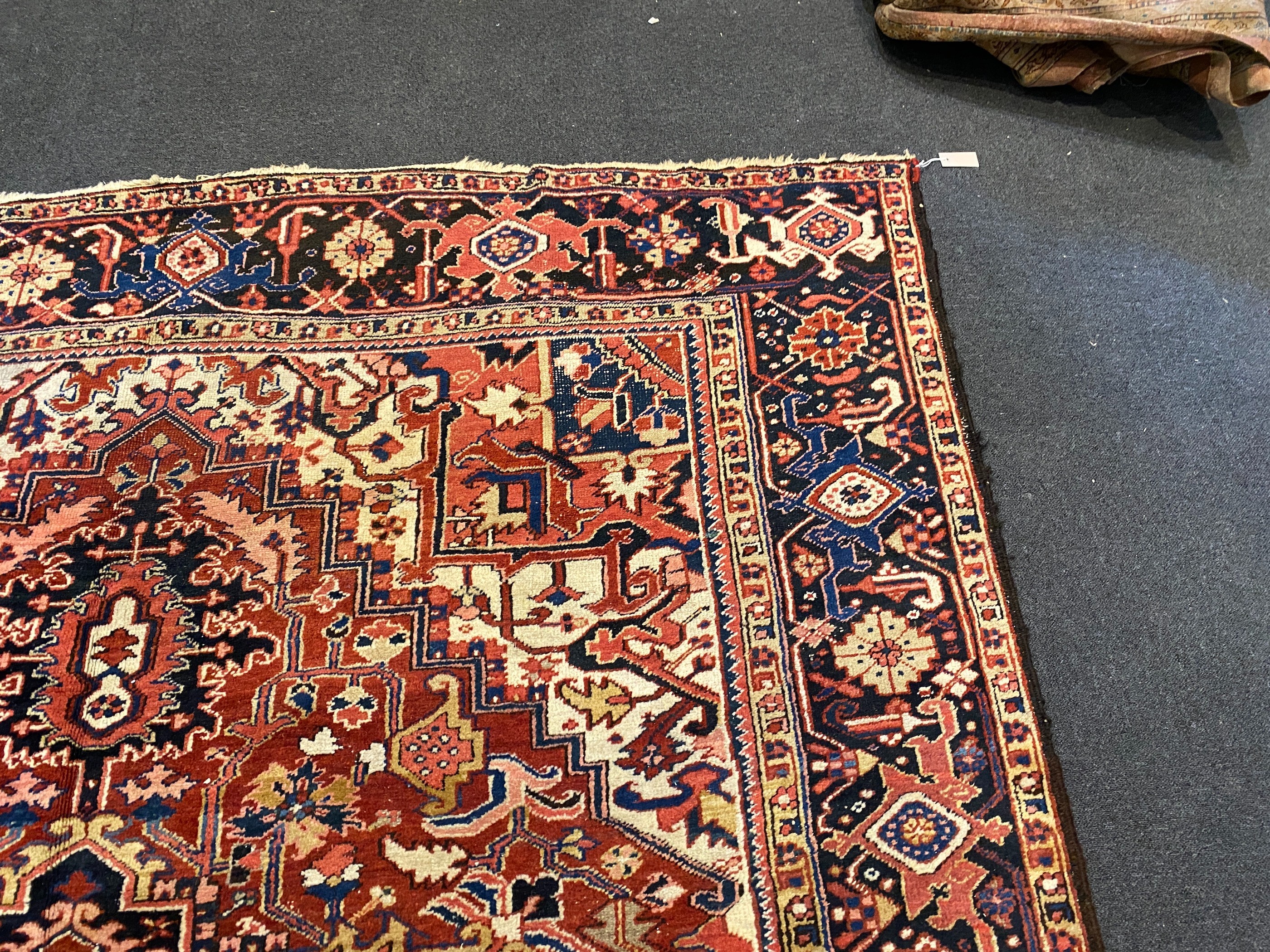 An Heriz red ground carpet, 364 x 265cm